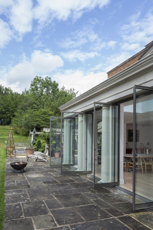 Project number 1000 - The new extension cum conservatory with large doors ensures the terrace and garden become an extension of the house